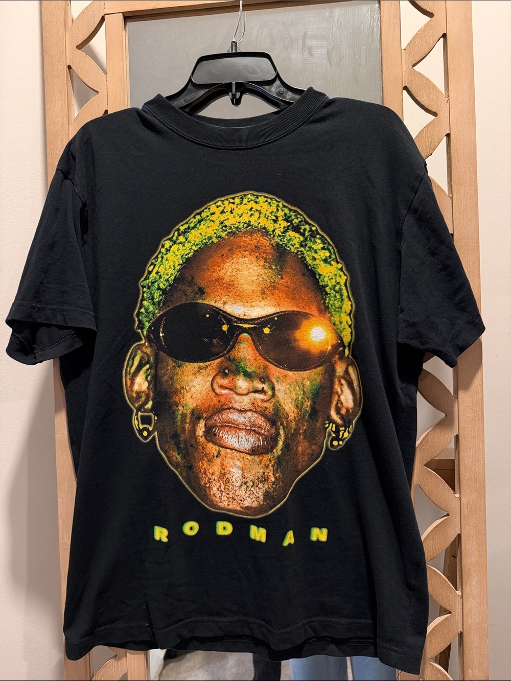 Black Short-Sleeve Graphic Tee with Yellow and Green Portrait